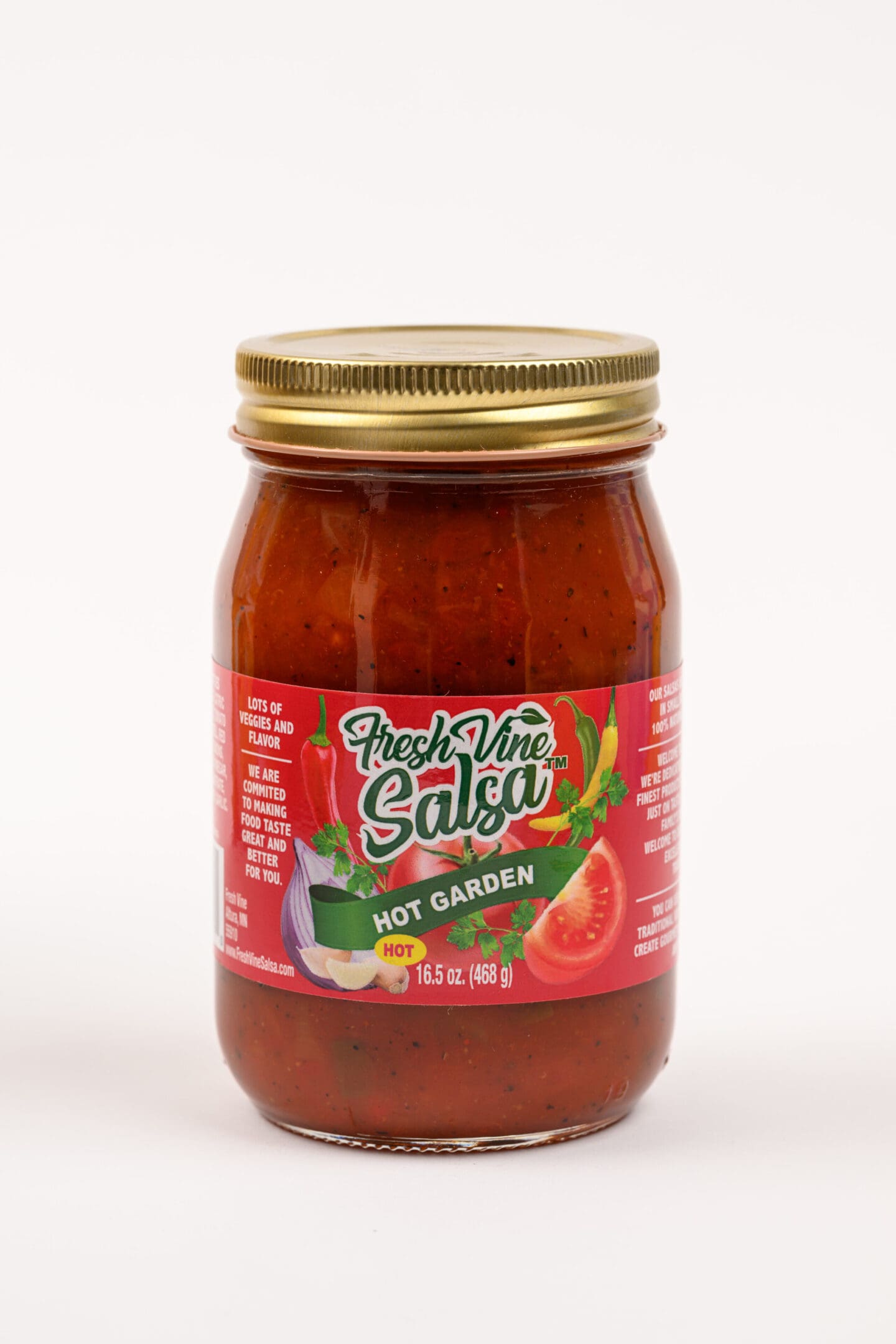 A jar of salsa with tomatoes and onions.