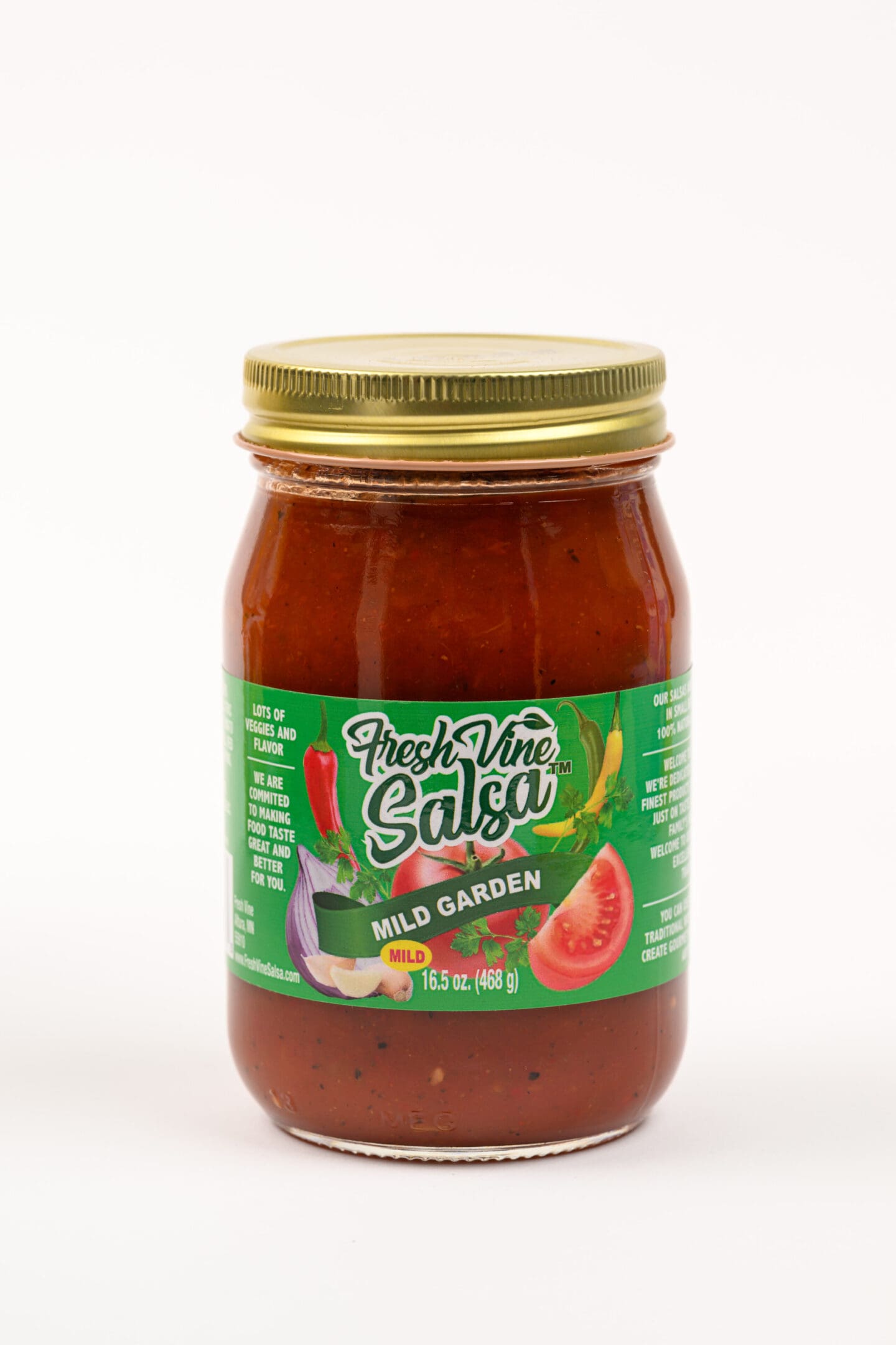 A jar of salsa with a green lid.