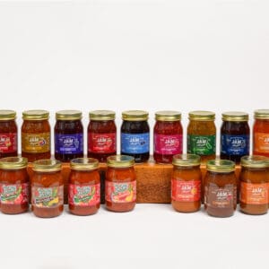 A row of jars filled with different types of food.