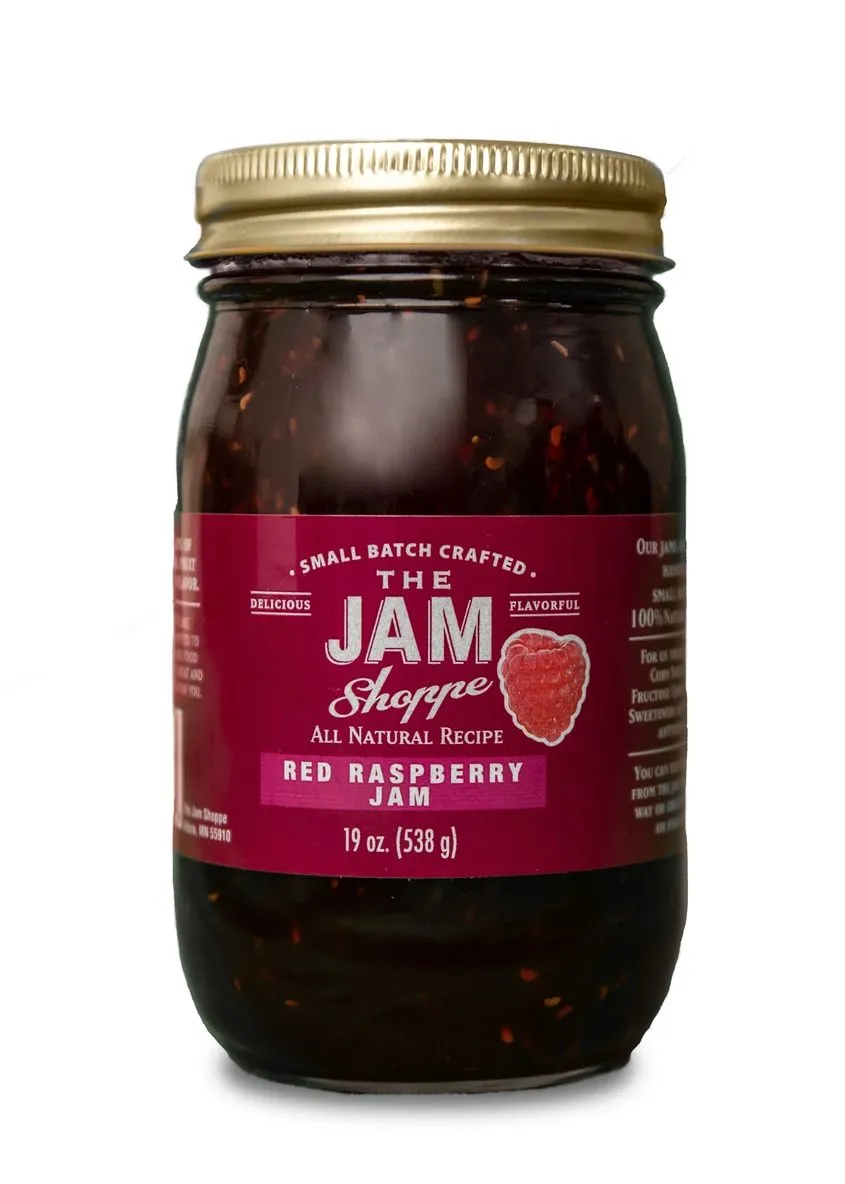 A jar of red raspberry jam.