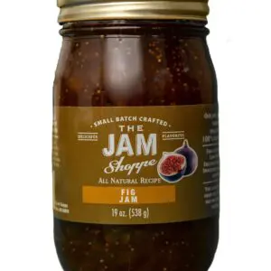 A jar of jam with a brown label on it.