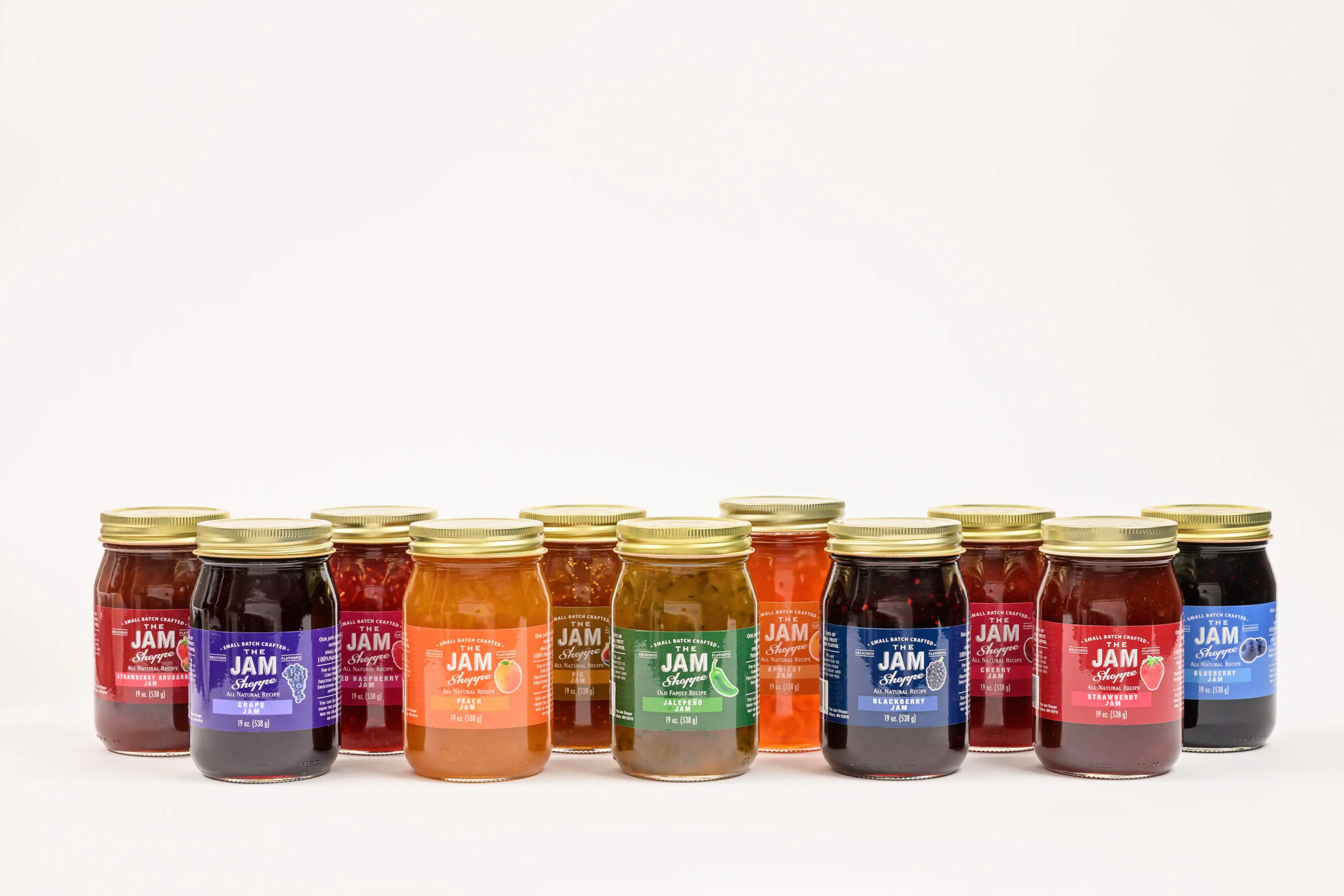 A row of jars with different flavors on them.