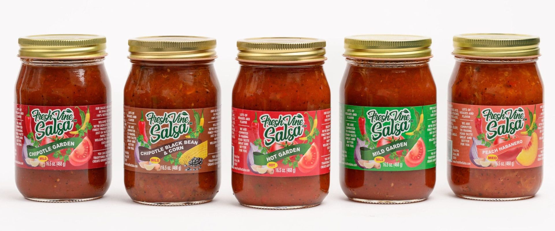 Three jars of salsa are shown on a white surface.