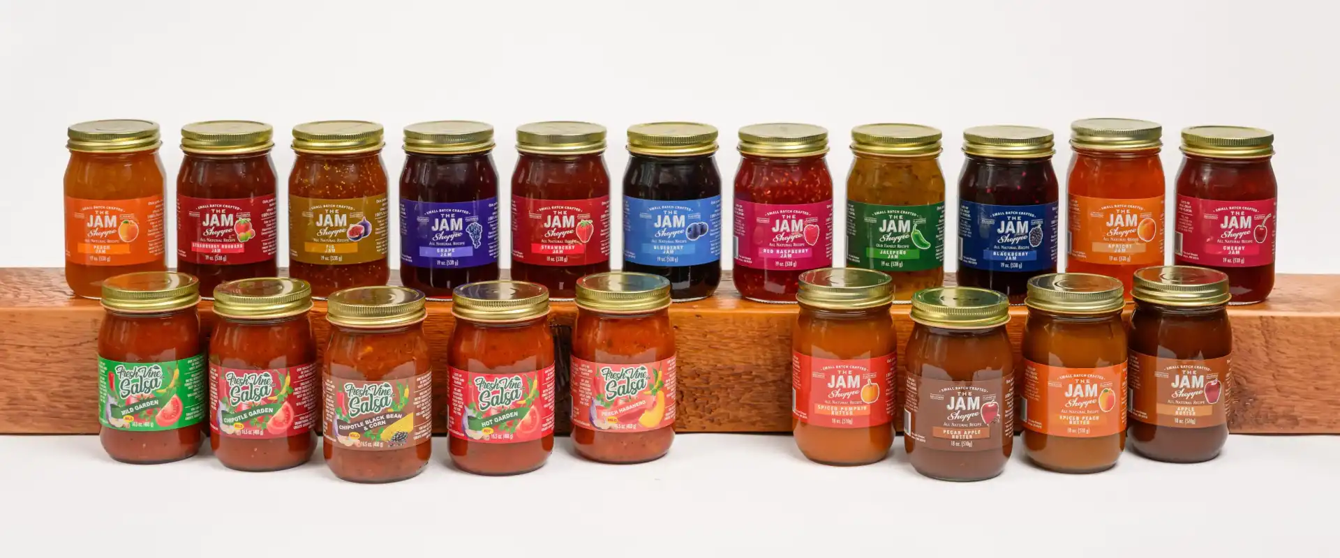 A group of jars with different flavors on them.